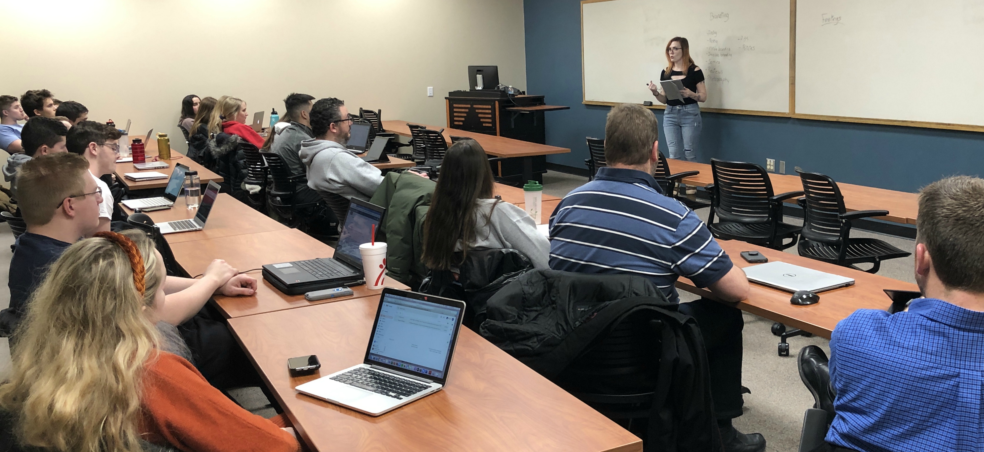 Starla Moore teaching a college-level marketing class, sharing expert strategies on branding, Etsy growth, and consumer psychology with university students.